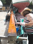 That's my girl! Giving the main mast a final coat of varnish!