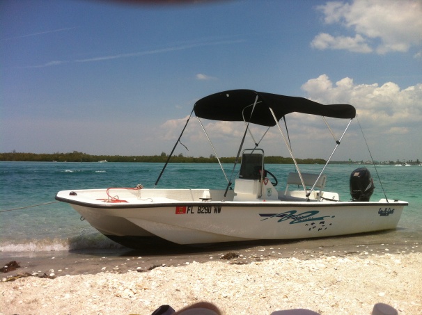 This is [Puddle Jumper], my favorite little skiff from Freedom Boat Club, Cape Haze, Florida. Seen here at the beach along the north end of Palm Island, Florida
