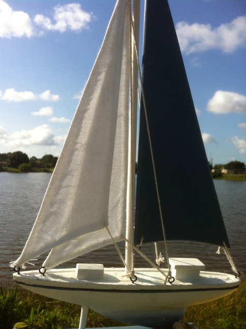 My latest yacht - a cutter-rigged, twin-cabin one-footer. She's a bit of a challenge in all but the lightest air, but she's mine! Now if I can just think up a good name...