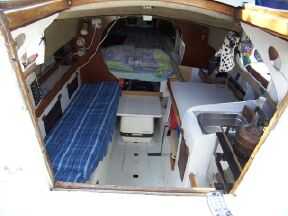 Inside was very small, Tight double up fwd, a chemical toilet under the seat and a 6 foot seaberth/ sofa to port and no quarter berths