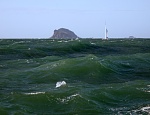 Standing up waves off Split Island, Queensland. 25 knot winds against 4 knot tidal flow. Grainger 1250 catamaran in background.