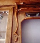 Detail in Art Nouveau style kitchen cabinets.