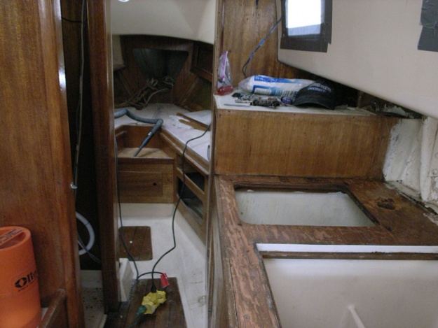 Interior before removal to replace rotted chainplate knees and main bulkheads. Fresh water leaked down standing rigging through chainplates and caused rot in knees and main bulkheads. I removed rotted interior pieces and kept for patterns.