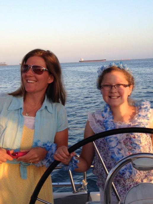 My sis and niece went with me to Catalina Island.
Niece can hold a course with the best!
Here we are sailing around Long Beach after dinner.