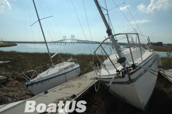 Just like I left her, but 50 yards from the water. As you can see, the marina is nothing but lonely pilings. The photographer for Boat US said if I could have this pic of my boat.