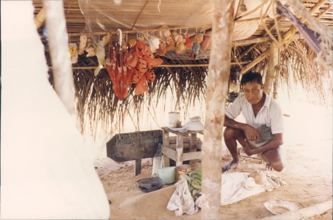 Our Cuna guide showing a burial hut. We had to paddle up the Carti Tupil River to where the water got brackish or fresh. They would gather water, wash clothes and bury their dead.