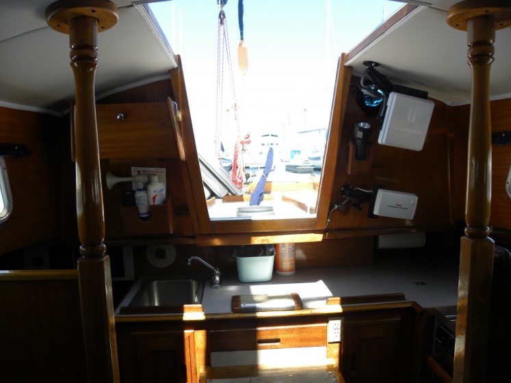 Looking Aft through the Companion Way. Radar & GPS Screens on Port. They swing out into Companion Way to be viewed from the Cockpit.