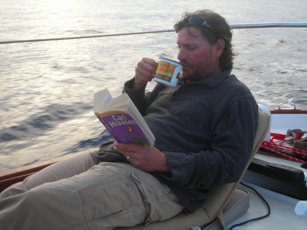 Sunset trick at the Helm of "Tess" Allied Seawind 30'.