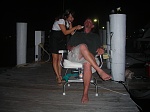 Dockside barber, getting a close shave, Nassau, Bahamas.