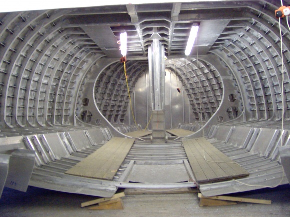 Destiny interior before the roll over.  2,500 stiffening horizontal strips to strenghten the hull for impact from ice or wood. The frames are at 400mm spacing, 6mm thick aluminium below the waterline. All the tanks form a double skin in the hull, you can see the access panels by the lights. Welding inside the hatches was so much fun....The huge central web frame is for mast support (keel stepped), equally huge frames take the chainplate loads down into the structure. Unusually we also have integrated lifting eyes, allowing the hull to be lifted by a container crane,  Mast up. But also useful in a normal boat hoist when we use a short slings and 5 ton shackles, that way we have no straps rubbing on our paint work or obstructing when we  are antifouling. All around win, win. Every boat should have them.