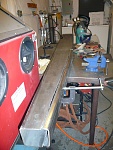 The coaming is bent for a test fit prior to welding. More grinding was needed to close the gaps up.