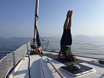 That's my girl, dooing yoga on board with a freind.