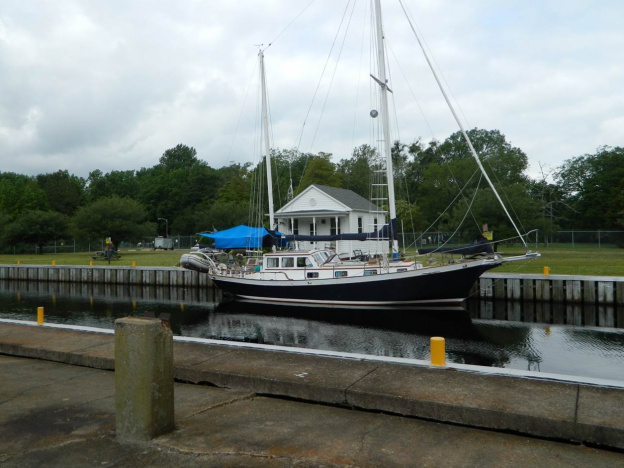 The Enterprise at the Mill Creek Lock in the Dismal Swamp Canal, waiting to lock down to sea level.