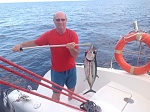 My friend and his catch while we crossed from Greece back to Sicily.