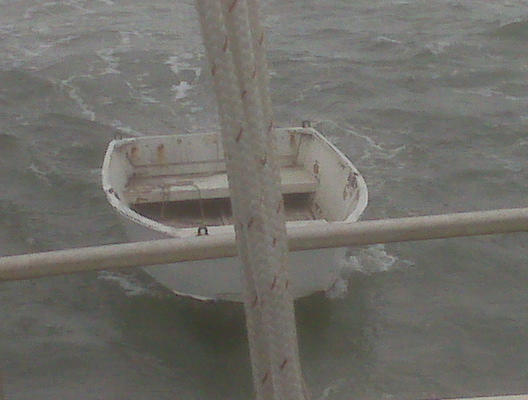 Dinghy on too short a bridle.  This is the last photo of it before it broke free just after crossing the shipping lane heading south to Half Moon Bay. Amazingly, the coast guard found it and I was able to retrieve it from them a few days later.