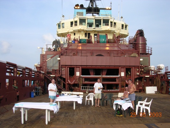 Xmas day in the Red Sea, me in the middle, the big bloke is the cook