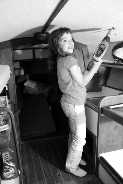 22b. 2009, Nicole 7. Now she has to duck. Little people would love the teak and complete layout in this Rob Roy 23.