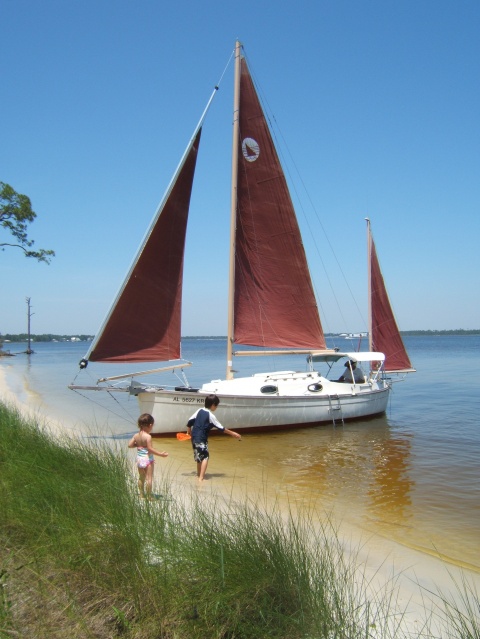 22a. 2010, My Rob Roy 23 Tupelo beached in Bay LaLaunch. Two of Liz Howard's children.