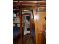 Molly B ,1976 flush-deck Hull#7. Starboard berth has since been converted to a work surface/cabinet. Done in such a way that it did not damage the berth so it can easily be re-converted. As should be for any real sea-boat... head forward ;~>. Quite a ride in certain conditions!