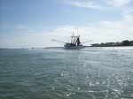 Shrimp boat headed out of the inlet