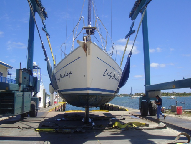 Haul out survey 4 weeks after hitting bridge. See water line showing twist, port side 3" higher than starboard