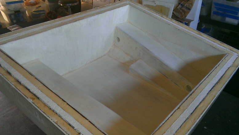 This is an alternate view of the interior, before painting, showing one of the two air-circulating vents built into a shelf.  The coldplate will be mounted on the side at the top of the pic, which is the forward side of the box. The two layers of polyurethane insulation can be seen sandwiching the while polystyrene templates for the future Vacuum Insulated Panels (VIPs).  A separate lid, with insulation and hatches, mounts (removeably) after the coldplate and LED lighting is installed.