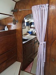 Aft/master Cabin looking forward past drinks cabinet, to galley and main/centre cabin