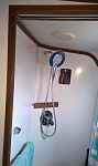 Upgraded shower with 10 litre 12v/240v water heater.