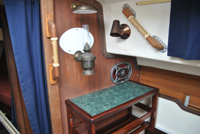 Port side saloon area with gimballed oil lamp