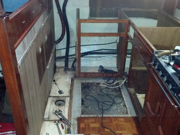 Forward cabinet removed, plywood underlayment removed